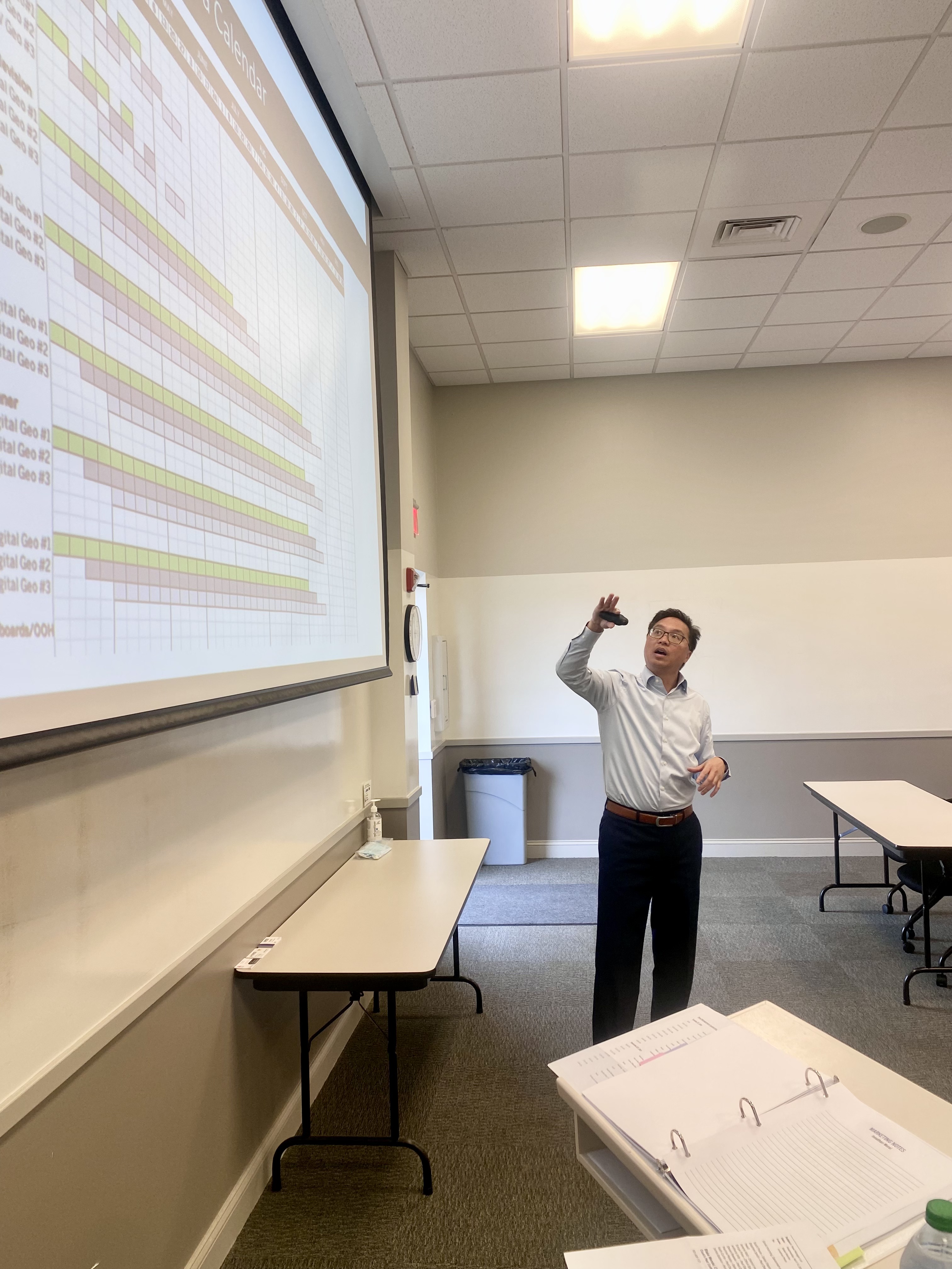 Jonathan Moral walking a team through a media flight calendar on screen
